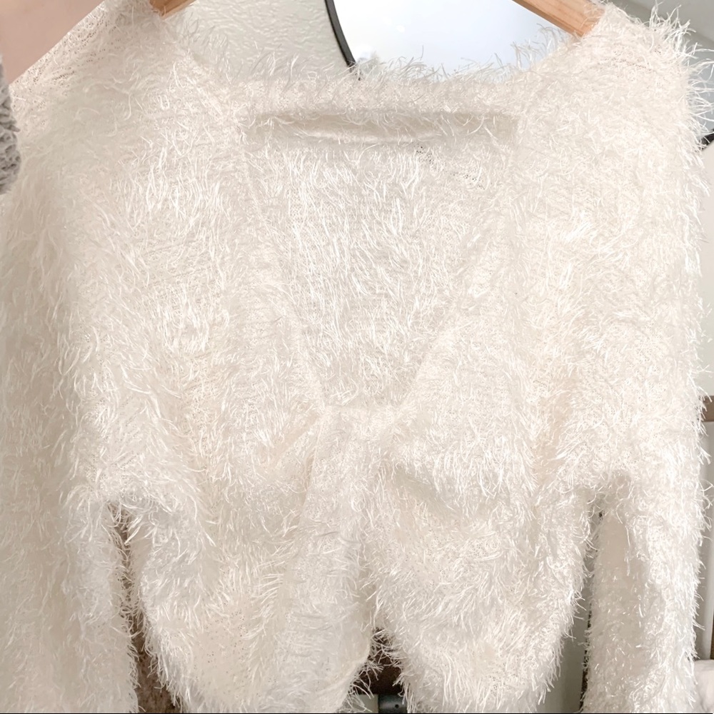 fluffy white knitted sweater w/ twisted open back